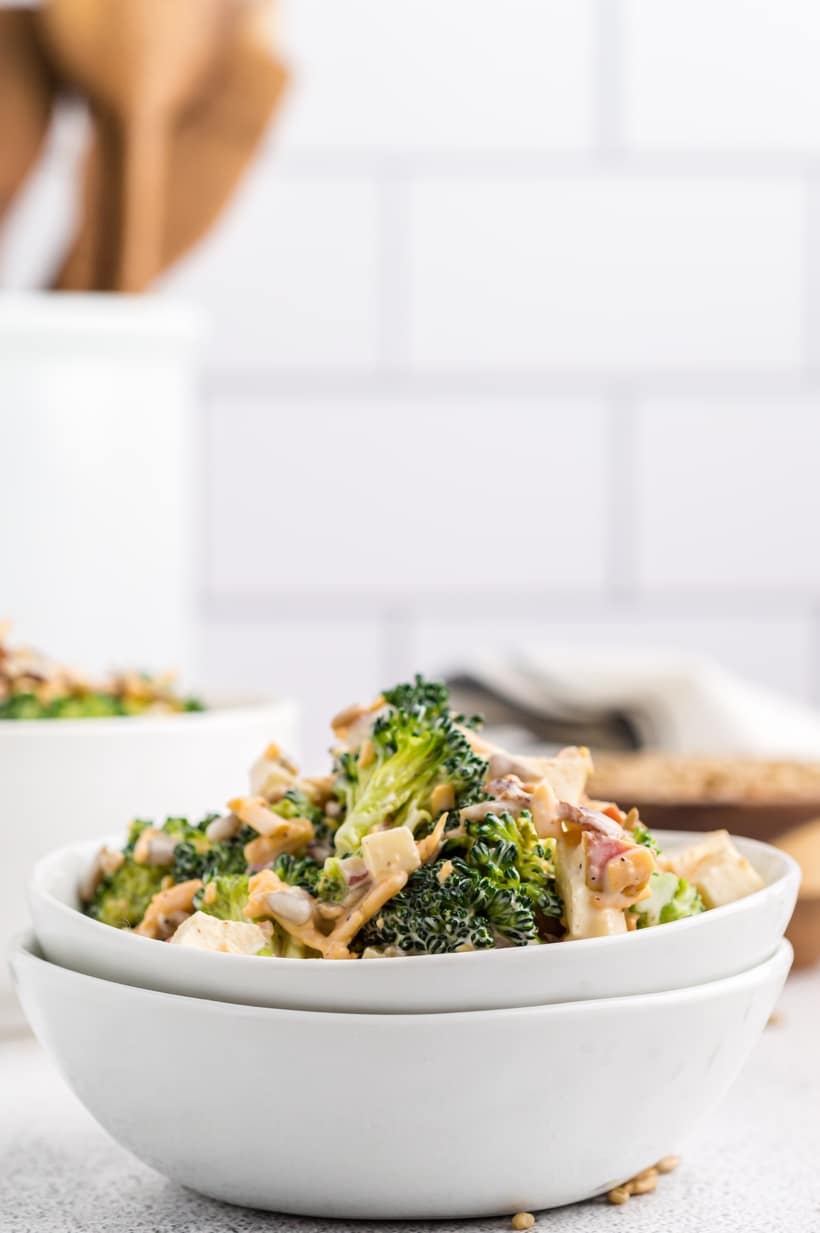 Bacon Broccoli Salad as a single serving A single portion of bacon broccoli salad served in a small white bowl, with bright colors and textures visible.