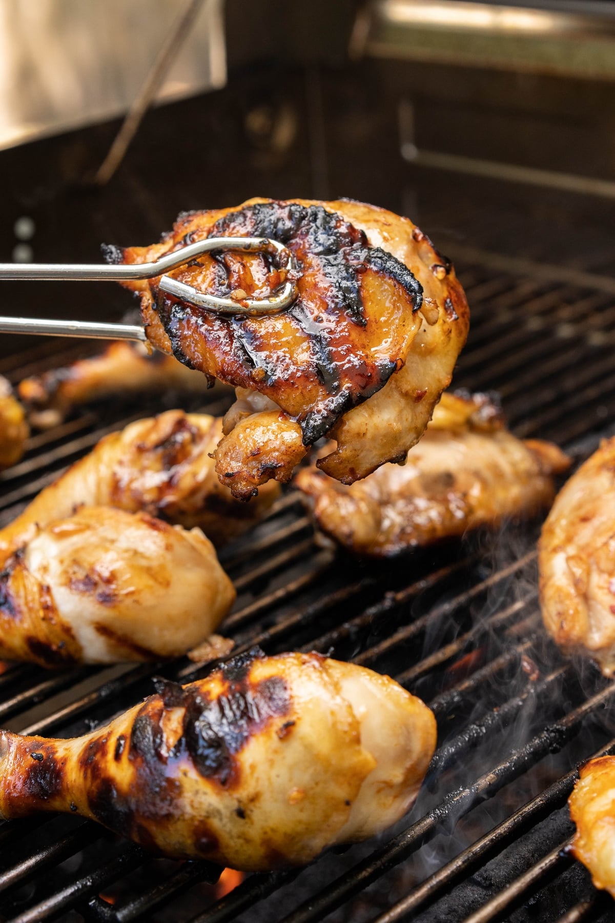 Grilled spicy honey garlic chicken that's a perfect balance of sweet heat, just the way I like it. Trust me, this chicken will be your go-to grilling recipe. chicken on the grill