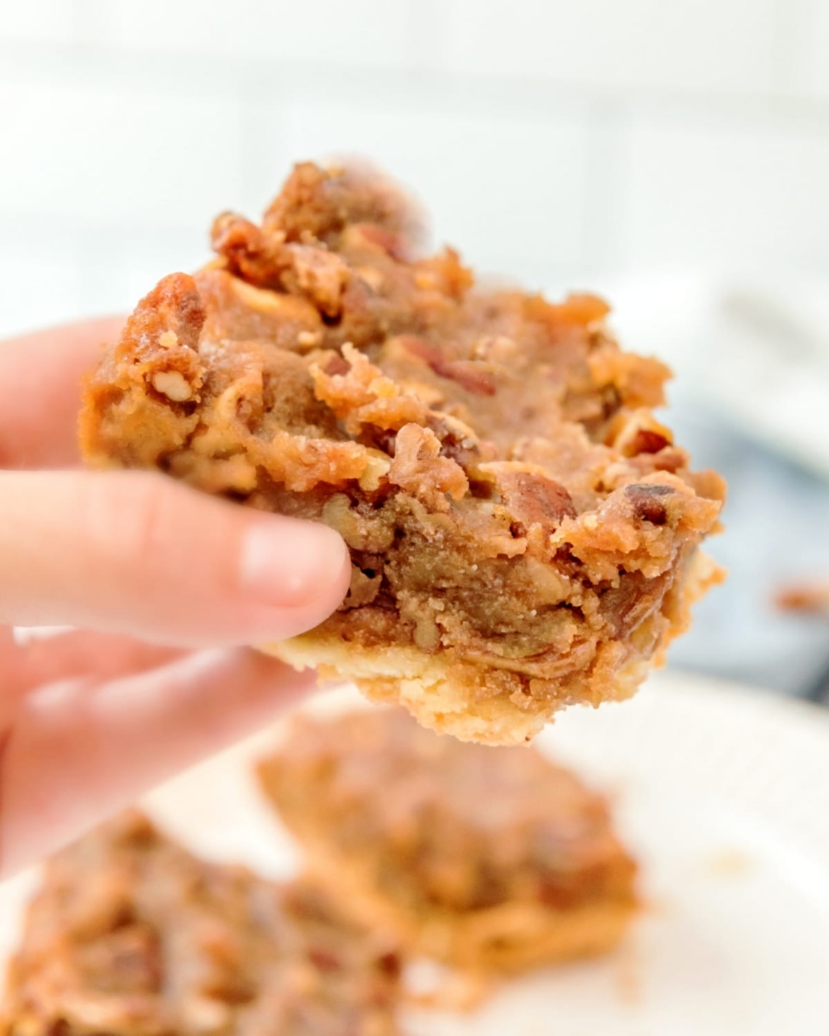 These pecan pie bars pack all the classic flavor of pecan pie into easy, bite-sized squares with a buttery shortbread crust. Perfect for serving a crowd—no pie making skills are necessary for this recipe. pecan bars