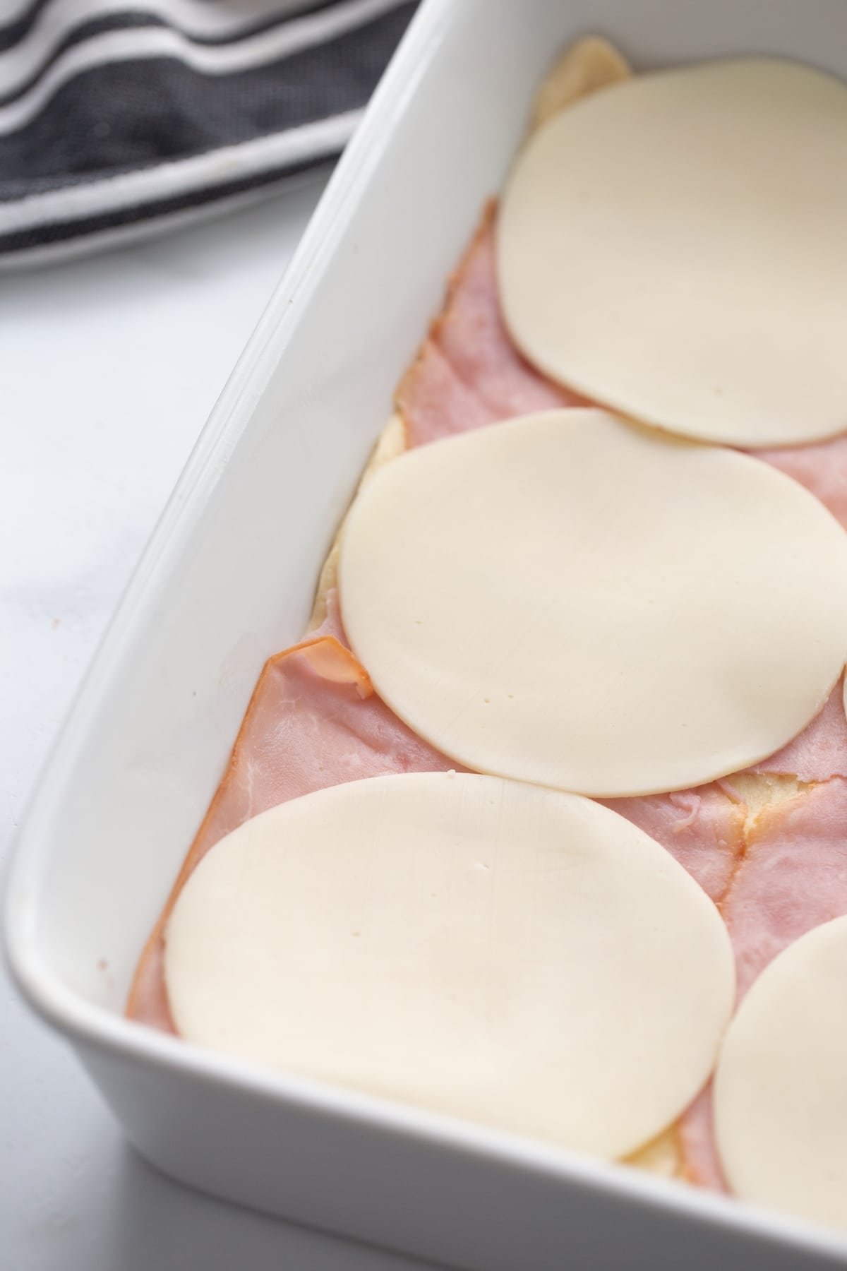 provolone cheese layered on top of ham