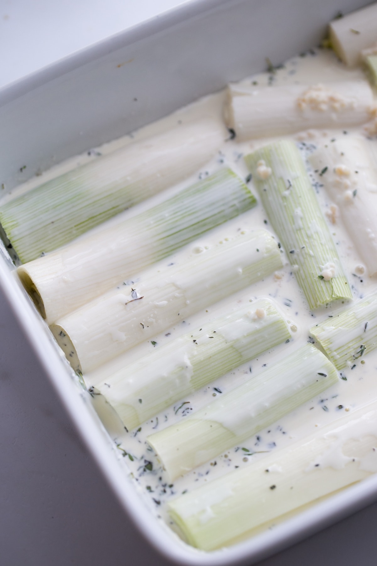 Creamy Roasted Leeks in sauce. Creamy leeks in sauce with thyme.