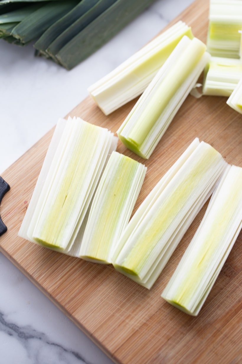 Sliced leeks before cooking sliced leeks on a cutting board