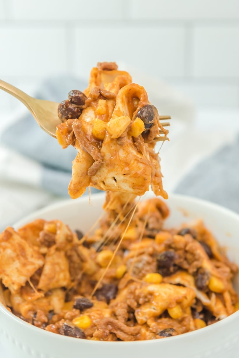This simple beef burrito skillet recipe combines ground beef, corn, enchilada sauce and tortillas into a delicious one-pan meal. The flour tortillas soften during the cooking process and take on a pillowy-soft texture that helps make this dinner a slam dunk. Beef burrito skillet meal