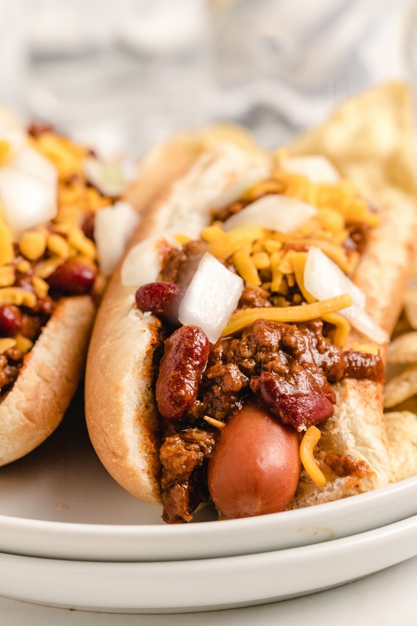 Hot Dog Chili for game day hot dog chili poured over a hot dog in a bun