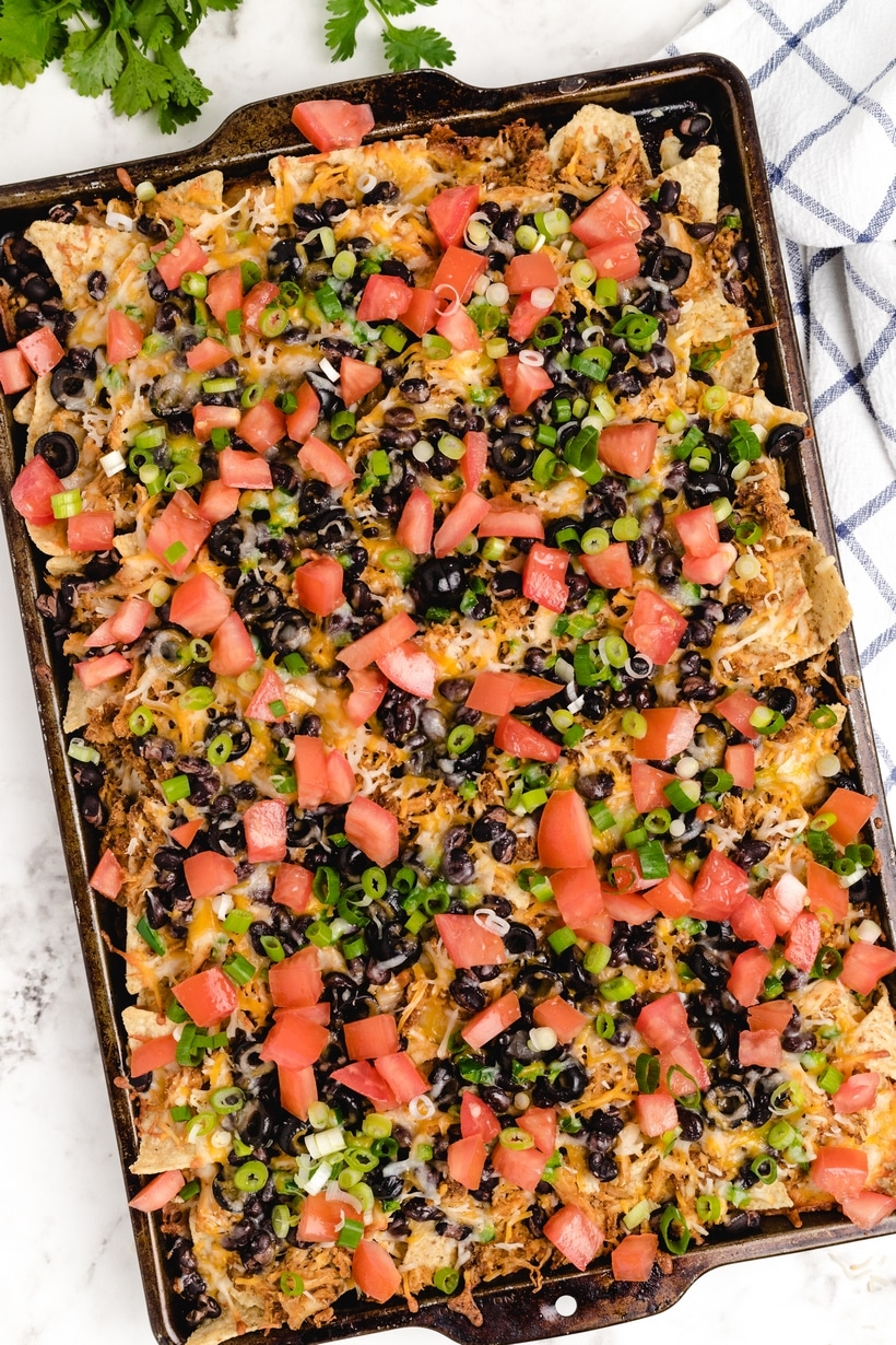 If Sheet Pan Nachos are not part of your weekly meal plan, it's time to add them to the rotation. These loaded nachos are quick, flavorful, easily customizable and budget friendly. nacho substitutions