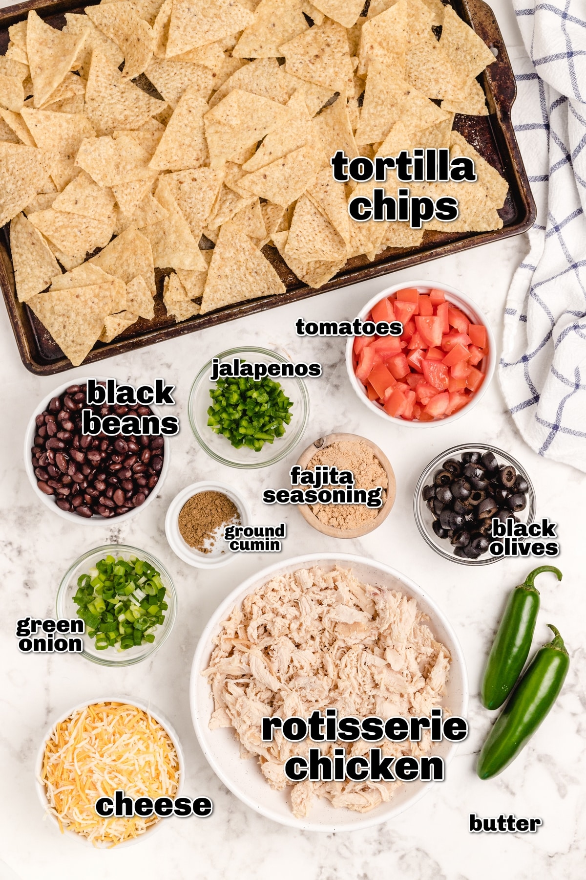 It's time to add these sheet pan chicken nachos with a creamy lime drizzle to your weekly meal plan. These loaded nachos are quick, flavorful, easily customizable, and budget-friendly. I make them whenever I have leftover rotisserie chicken. ingredients