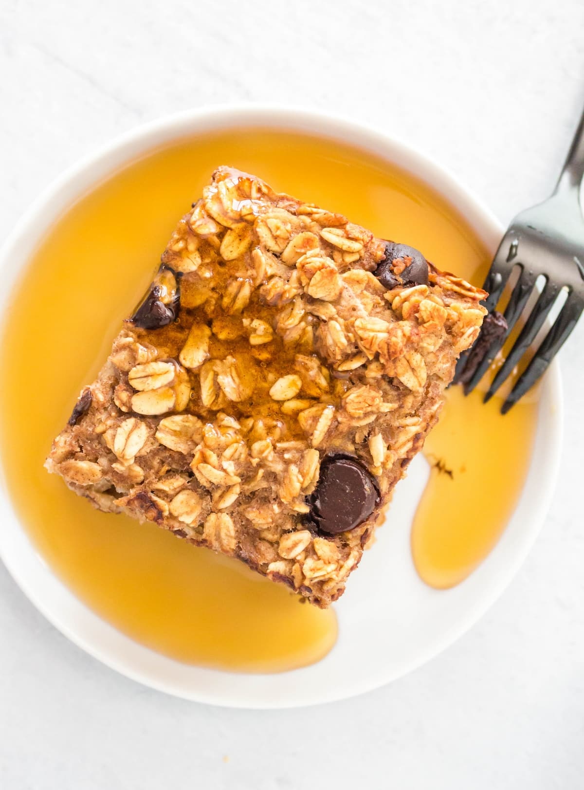 These baked oatmeal bars were made to be something special, with a moist, creamy interior and just the right amount of breakfast-friendly sweetness. chocolate chip oatmeal bars