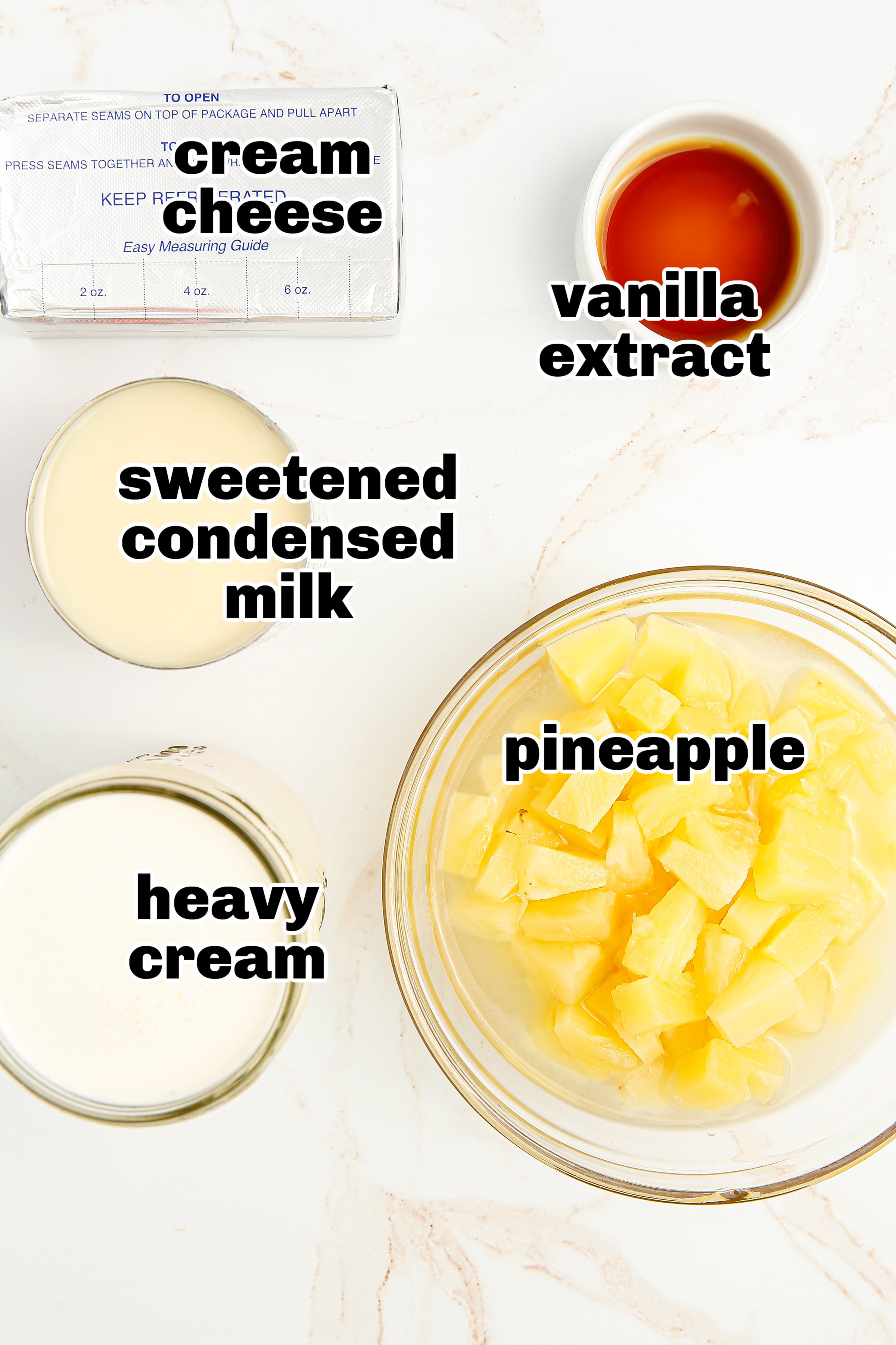 Ingredients for no-churn pineapple ice cream laid out on a counter