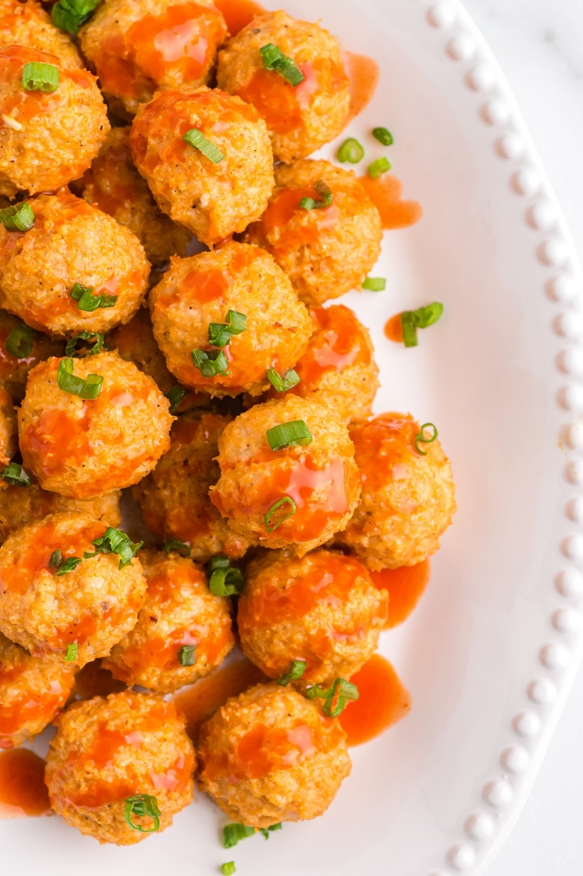 These buffalo chicken meatballs have that buttery, spicy kick I love. Made with ground chicken and a few pantry staples, they bake up in the oven while you get everything else ready. buffalo wing chicken meatballs