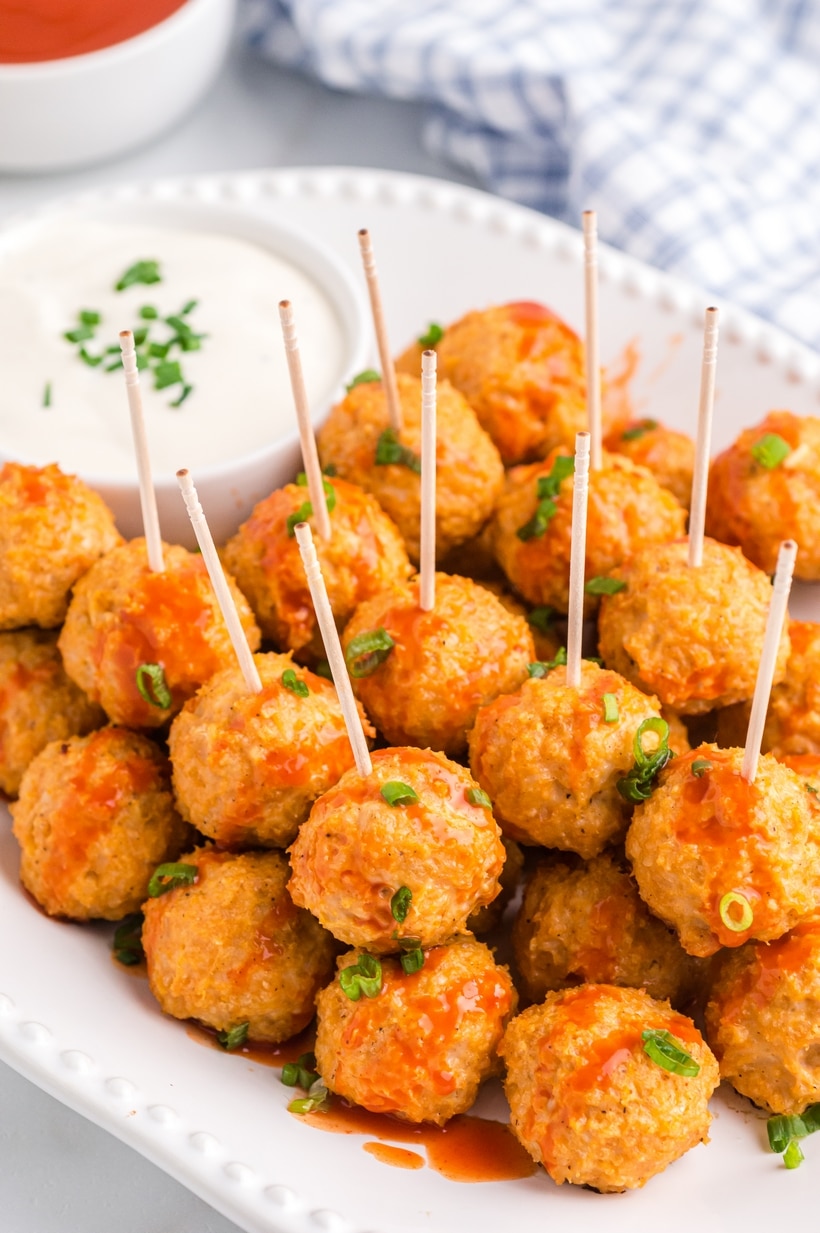 These buffalo chicken meatballs have that buttery, spicy kick I love. Made with ground chicken and a few pantry staples, they bake up in the oven while you get everything else ready. buffalo chicken meatballs