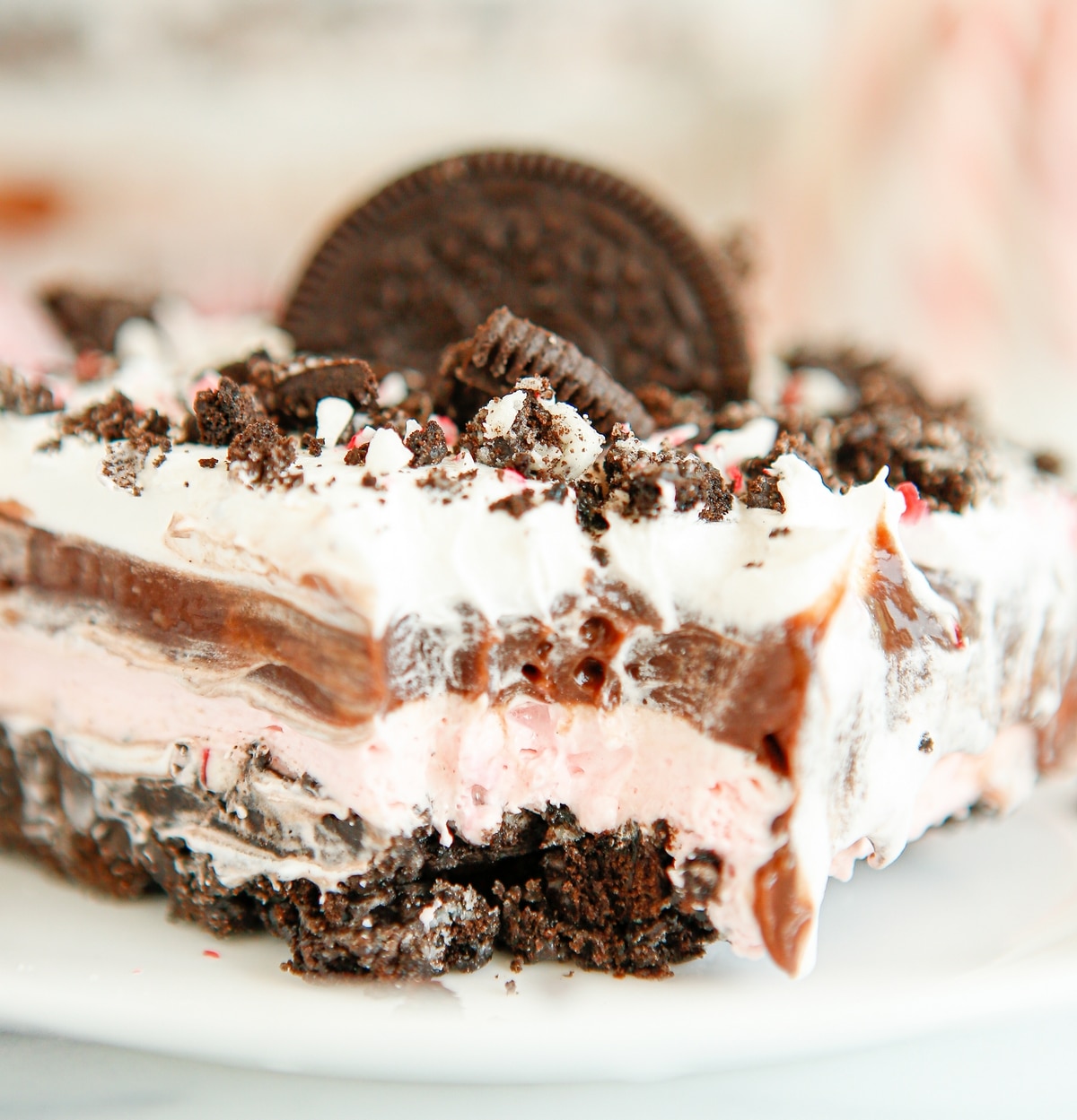 Festive Chocolate and Peppermint Dessert with Whipped Topping Holiday dessert featuring chocolate and peppermint layers with a buttery crust.