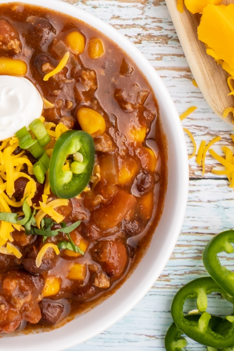 Overhead of taco soup in a white bowl.