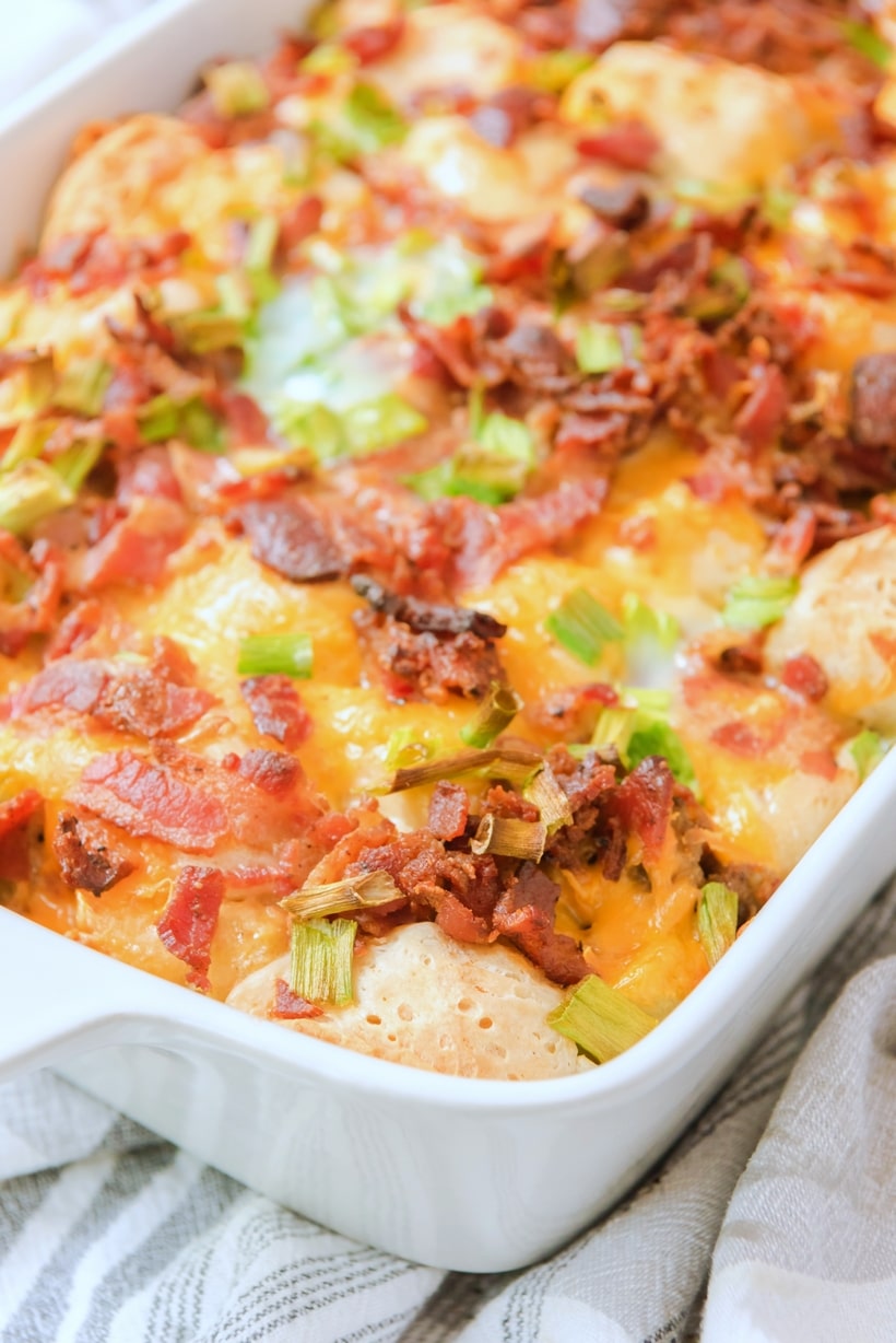 This Overnight (make-ahead) breakfast casserole with biscuits, bacon, sausage and tater tots is the perfect back-pocket recipe for when you’re hosting brunch or overnight guests. make ahead breakfast casserole