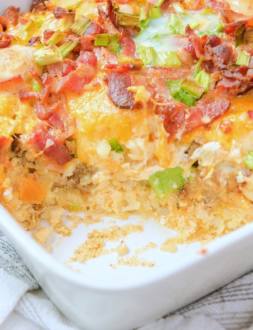 This Overnight (make-ahead) breakfast casserole with biscuits, bacon, sausage and tater tots is the perfect back-pocket recipe for when you are hosting brunch or overnight guests. This easy breakfast casserole recipe treats you to all the best parts of a breakfast plate in a single bite. breakfast egg casserole