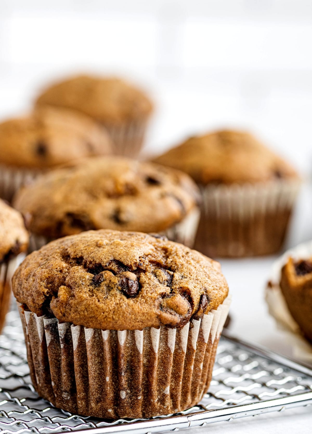 chocolate chip banana muffins on a cooling rack