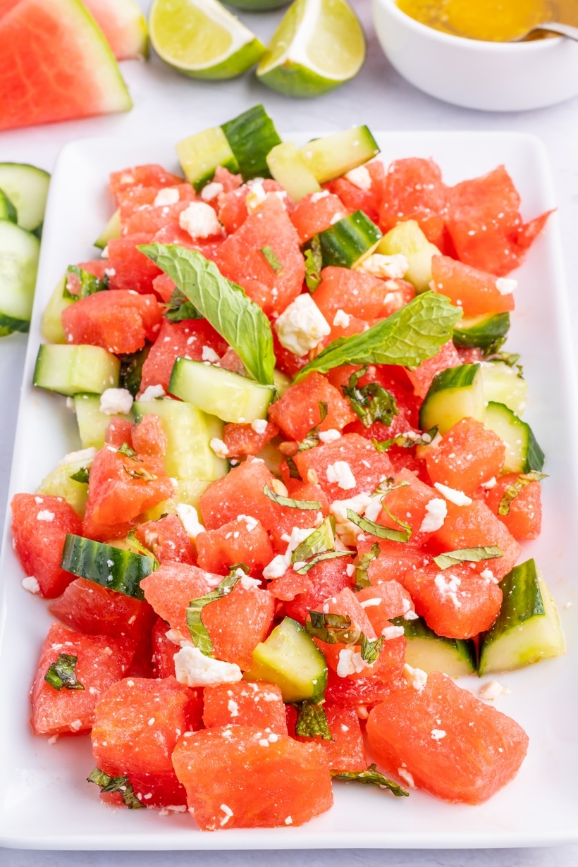 Summer watermelon salad with mint, cucumber, and feta cheese Overhead image of fully mixed watermelon salad with mint and feta evenly distributed