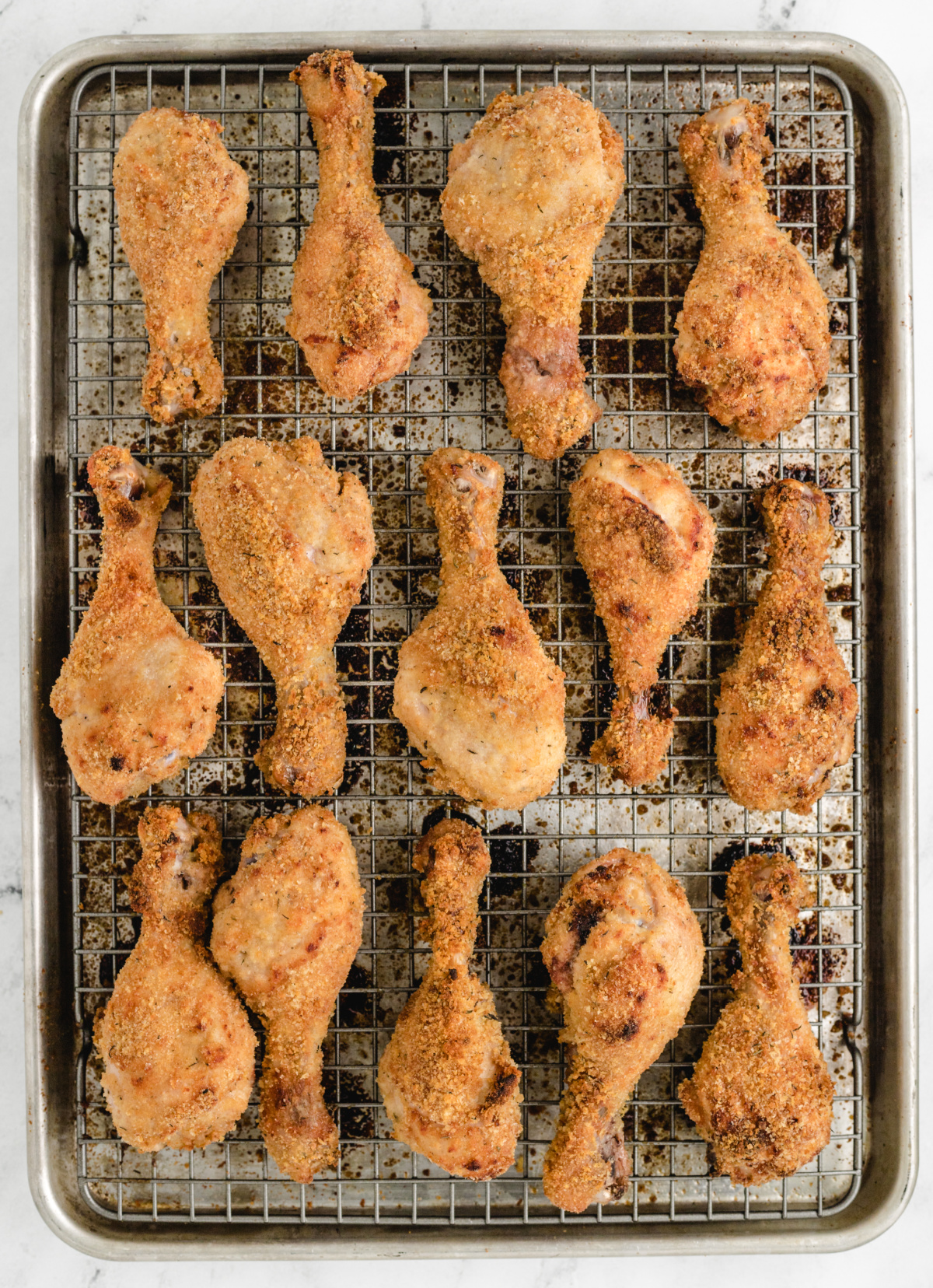 Crispy Baked Lemon Chicken Drumsticks crispy baked lemon chicken drumsticks cooling on a wire rack after oven baking