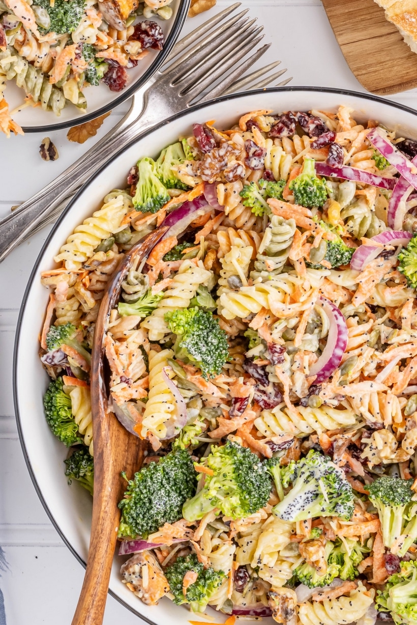 A fall pasta salad made with sweet potato, red onion and fresh broccoli with pasta noodles. A homemade poppy seed dressing ties all the flavors together. Perfect for tailgating, Halloween parties and as a cold Thanksgiving salad or side dish. roasted sweet potato salad