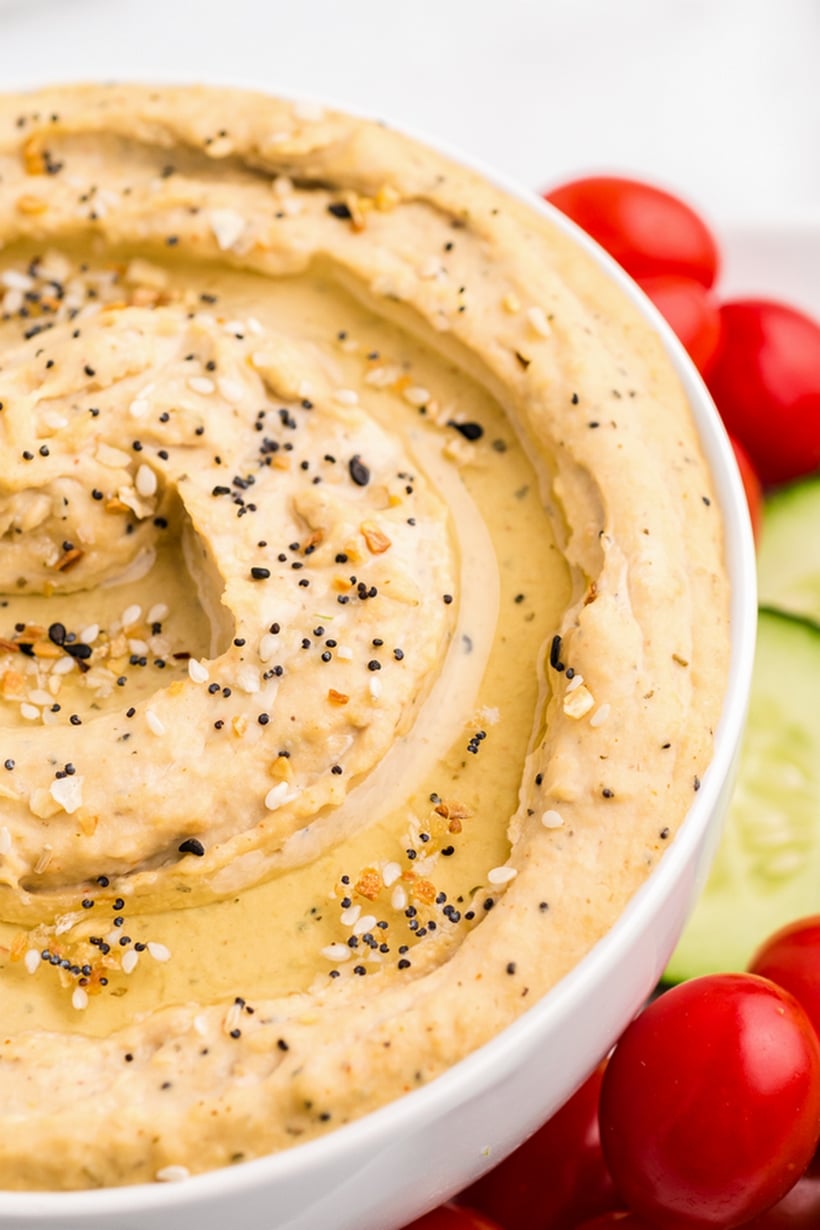 Ditch the pre-packaged options and make this simple, crowd-pleasing, homemade hummus recipe. Creating hummus from scratch is a breeze and I promise the flavor is far superior to the store-bought deli selections. Pair it with your preferred crackers or assemble it as part of a fresh vegetable platter. homemade hummus