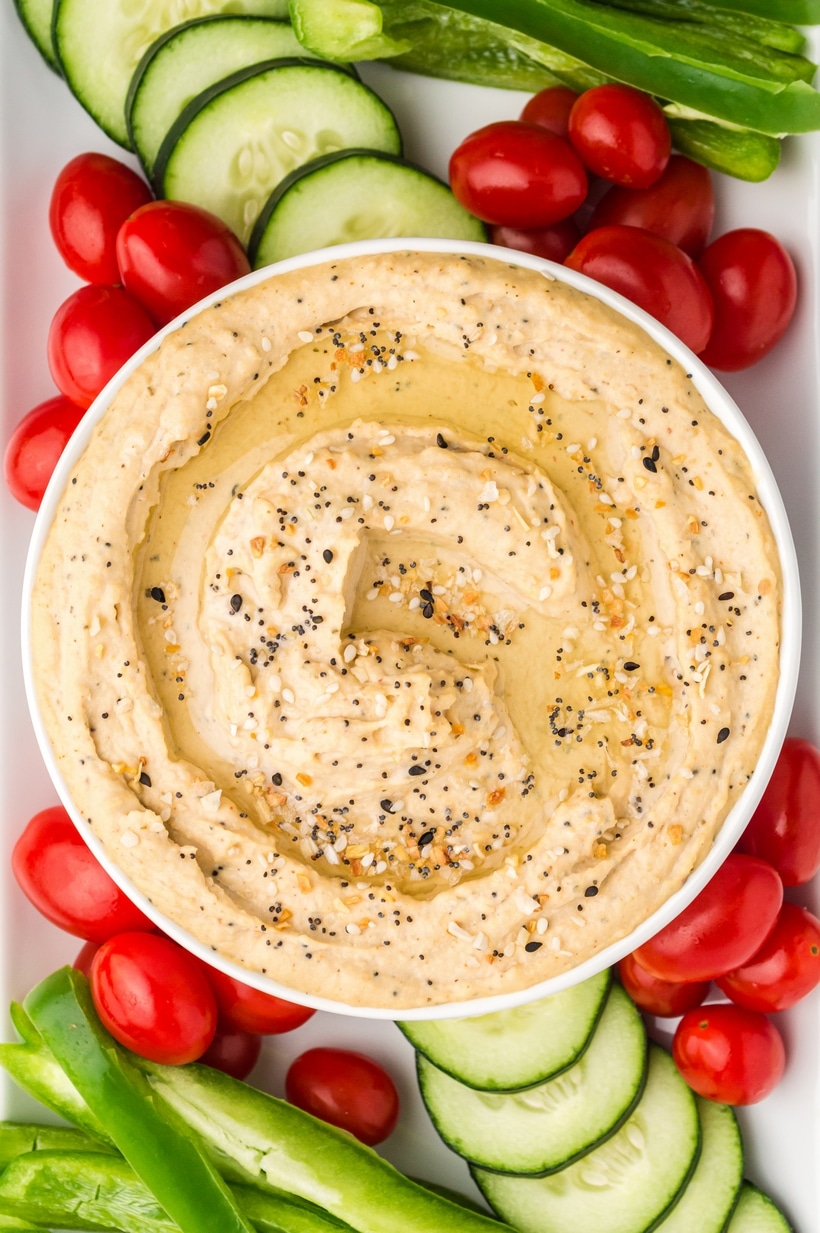 Ditch the pre-packaged options and make this simple, crowd-pleasing, homemade hummus recipe. Creating hummus from scratch is a breeze and I promise the flavor is far superior to the store-bought deli selections. Pair it with your preferred crackers or assemble it as part of a fresh vegetable platter. hummus