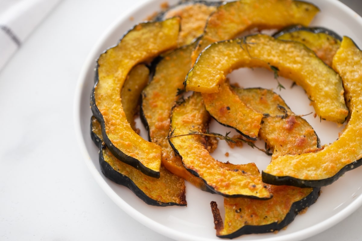 roasted acorn squash recipe with Parmesan melted onto each slice and made crunchy