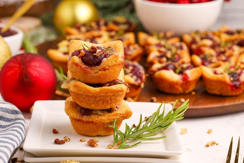 These cranberry Brie bites bring together gooey cheese, tart cranberry, and a hint of rosemary—all wrapped up in golden, buttery dough. Simple, festive, and always a hit. holiday appetizer with brie