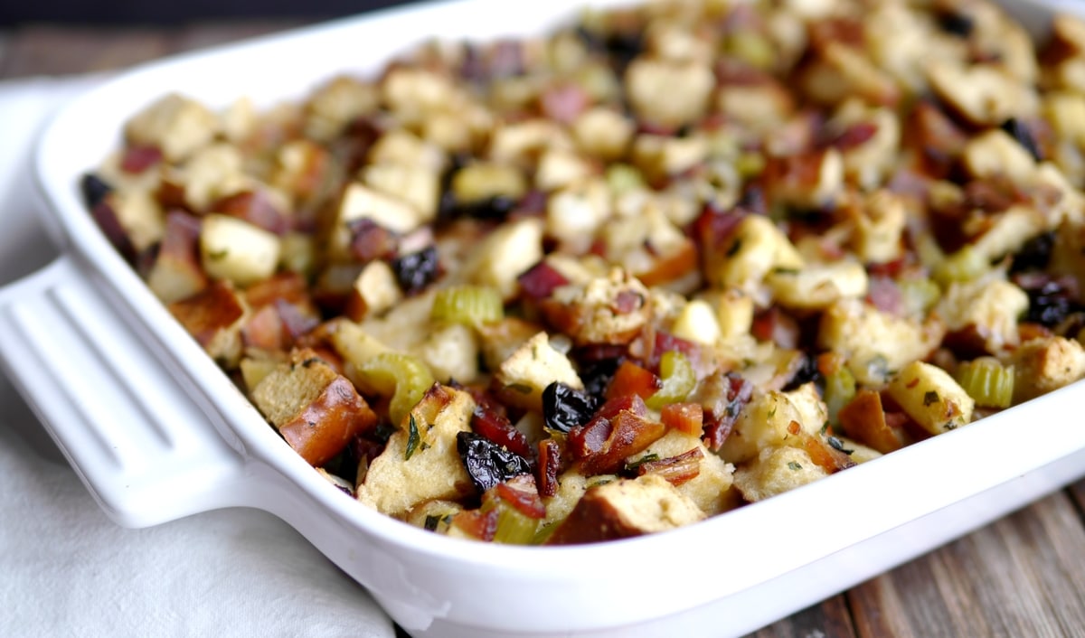 Close-Up of Baked Pretzel Bread Stuffing Close-up of pretzel bread stuffing with crispy top in a white baking dish.