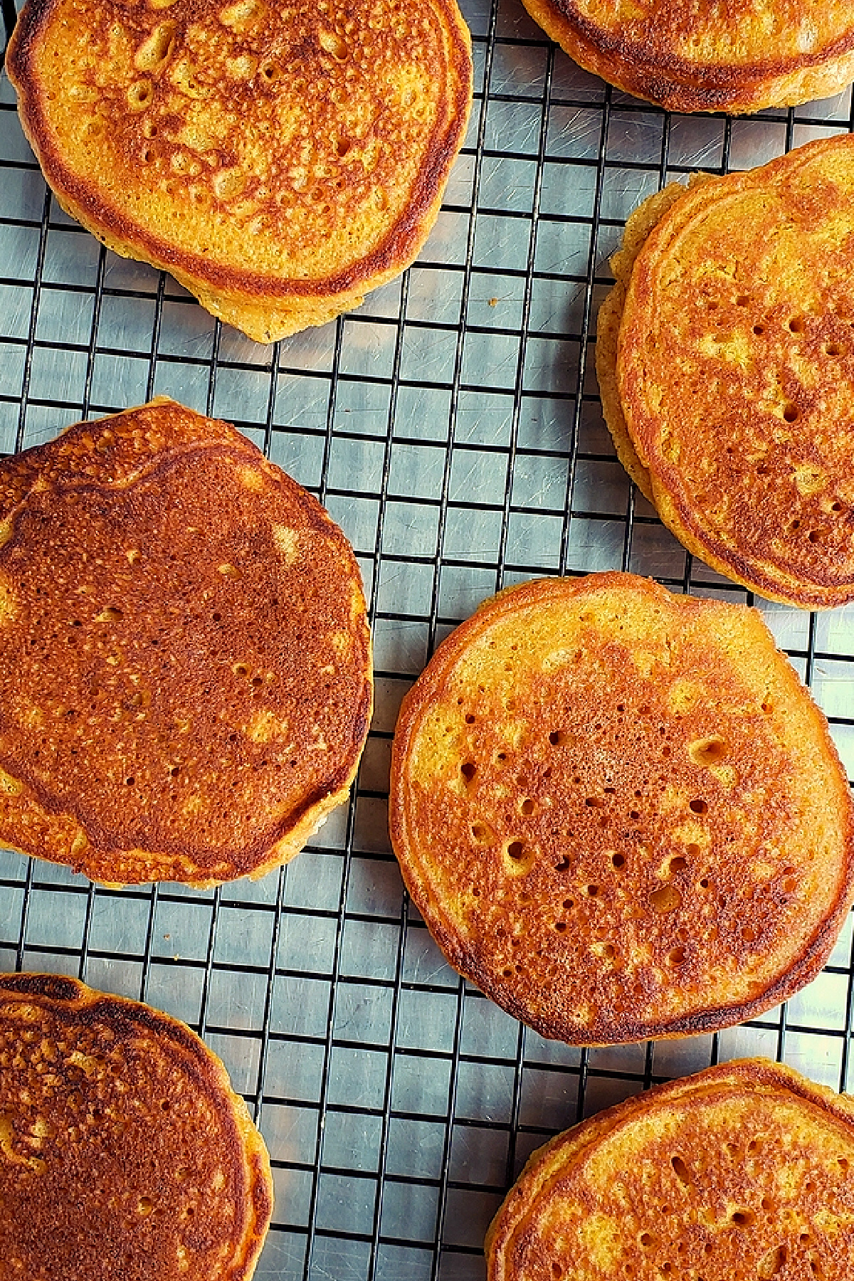 Pumpkin pancakes cooling rack. Pumpkin pancakes cooling on a wire rack after cooking.