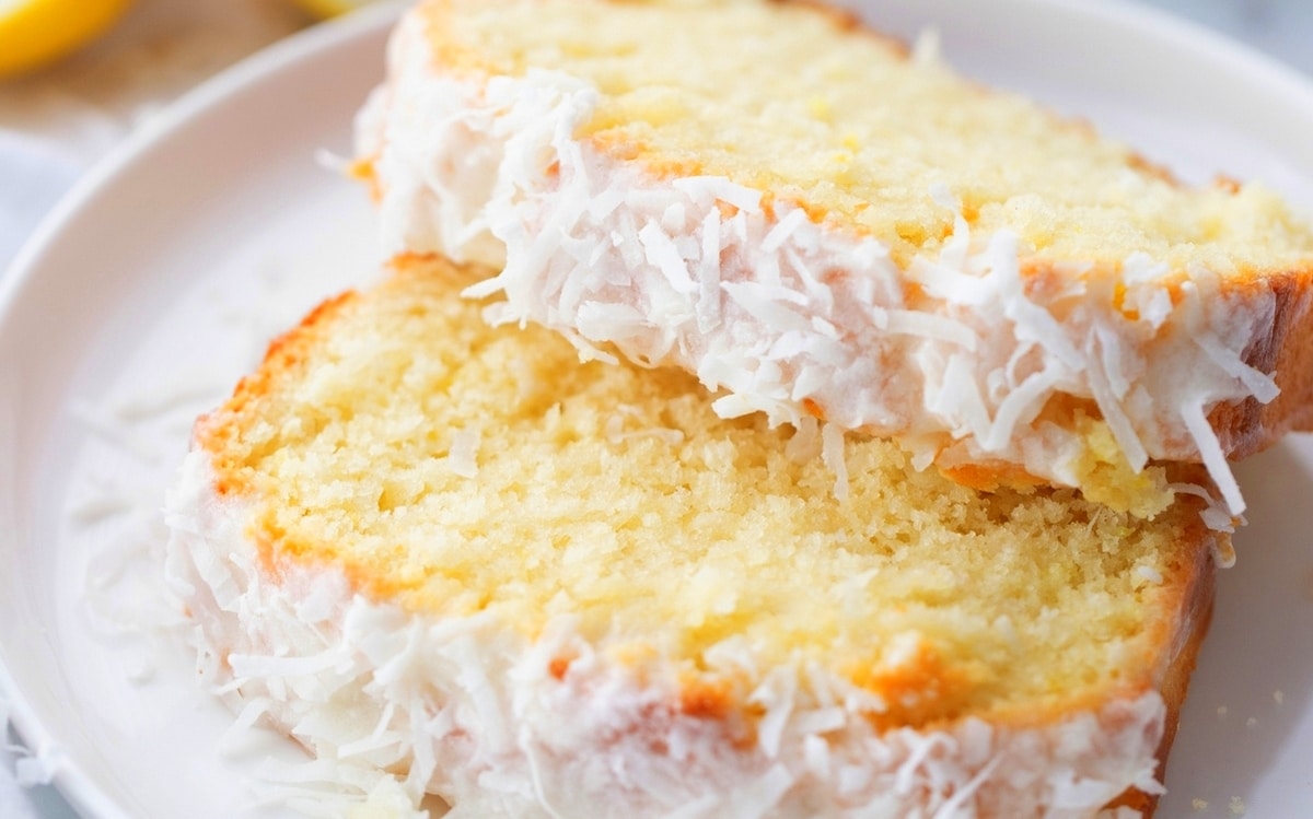 Close-up of two slices of lemon loaf Close-up of two slices of lemon loaf, highlighting the crumb and glaze.