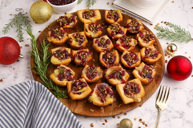 These cranberry Brie bites bring together gooey cheese, tart cranberry, and a hint of rosemary—all wrapped up in golden, buttery dough. Simple, festive, and always a hit. brie bites