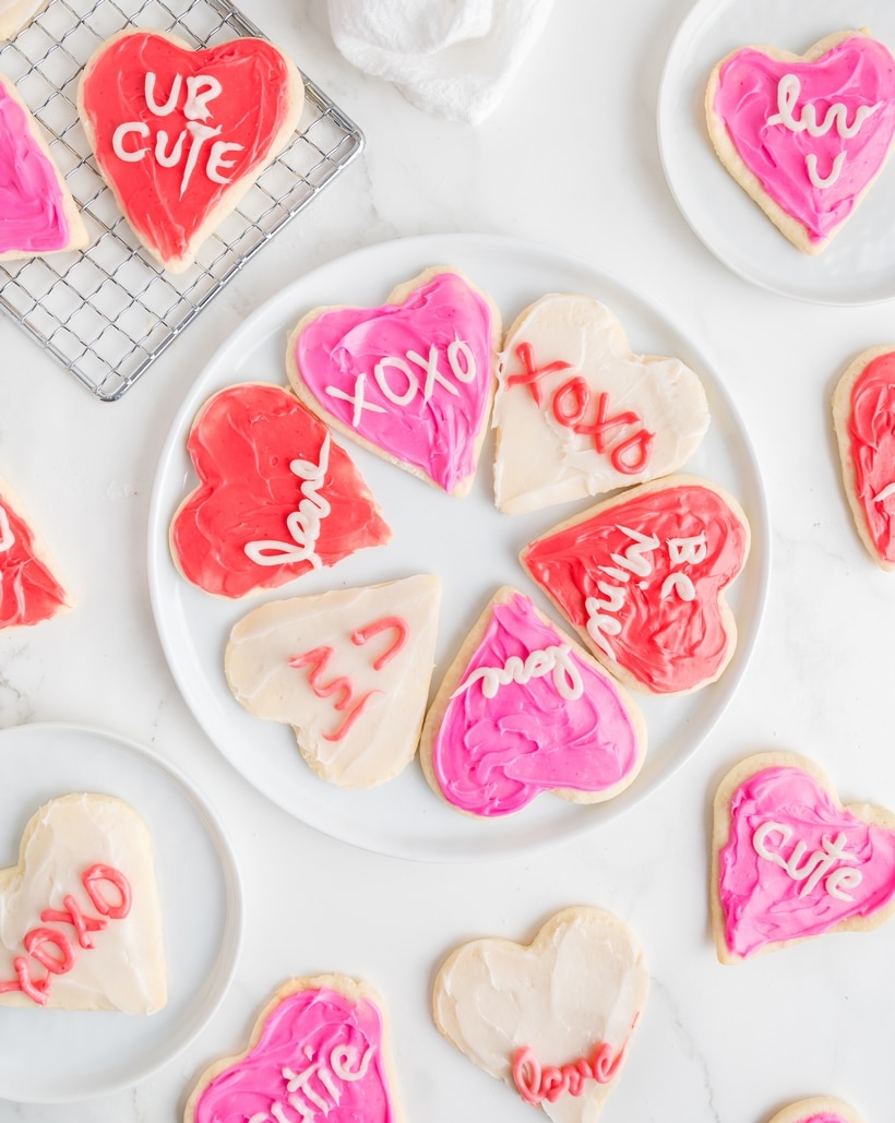 Heart-shaped sugar cookies frosted with pink and red icing.