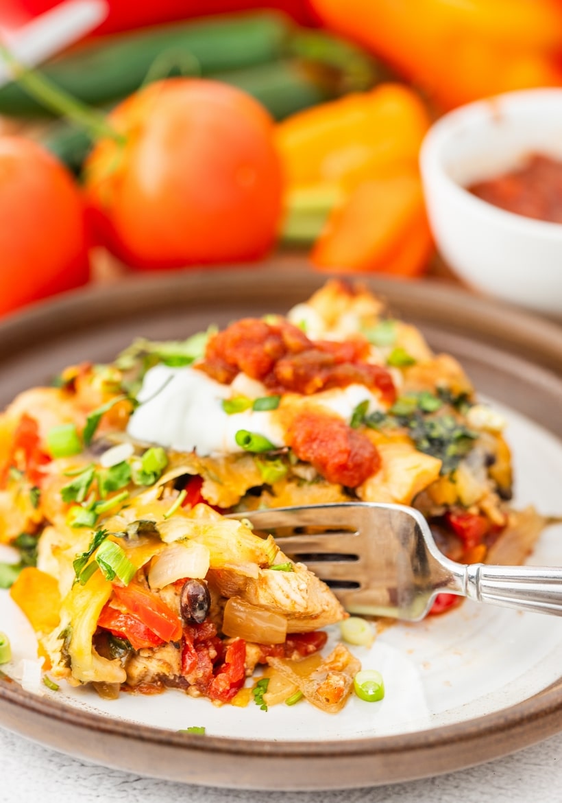 Chicken Fajita Casserole on a plate chicken fajita casserole on a white plate