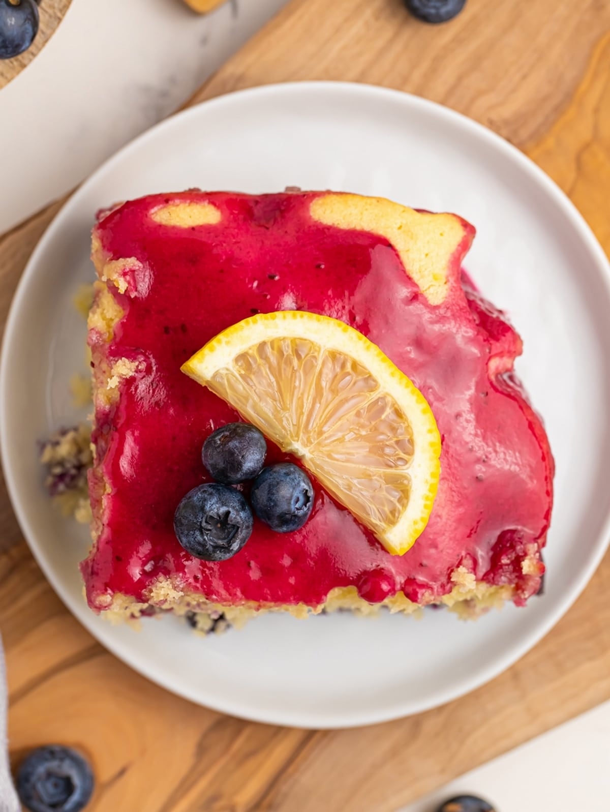 Treat yourself to a slice of heaven with my homemade blueberry lemon cake. It's the perfect balance of sweetness and citrus. Blueberry lemon sheet cake