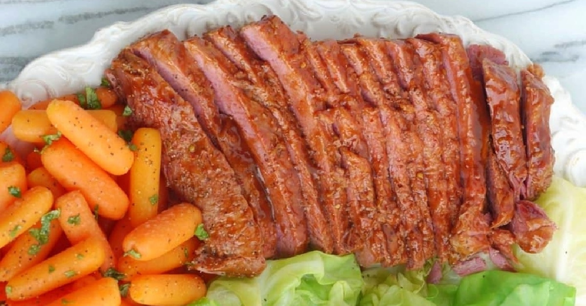 Sliced Whiskey-Glazed Corned Beef Close-up of tender corned beef slices showcasing the caramelized glaze and juicy texture.