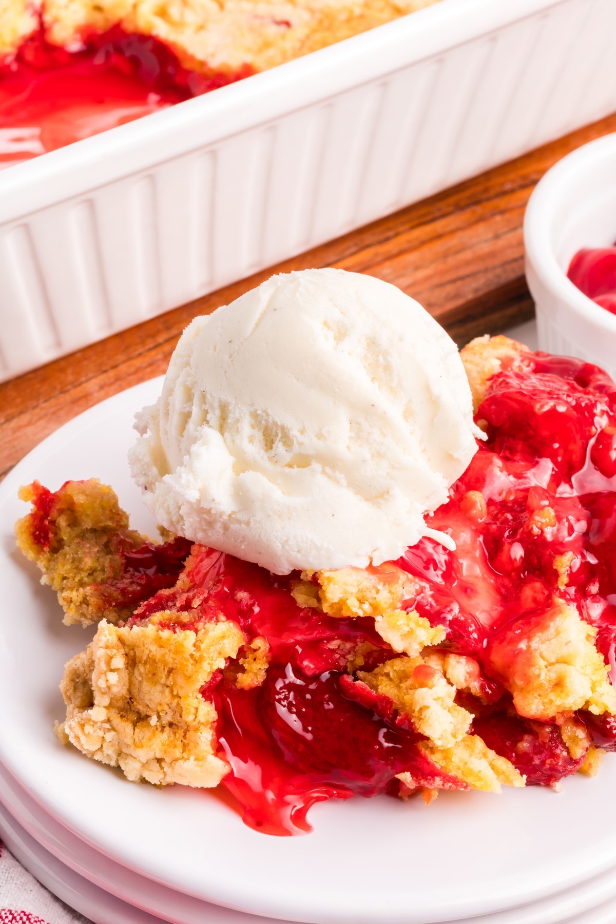 Make this quick and easy strawberry dump cake recipe. Top it off with creamy vanilla ice cream for an irresistible dessert. strawberry dump cake