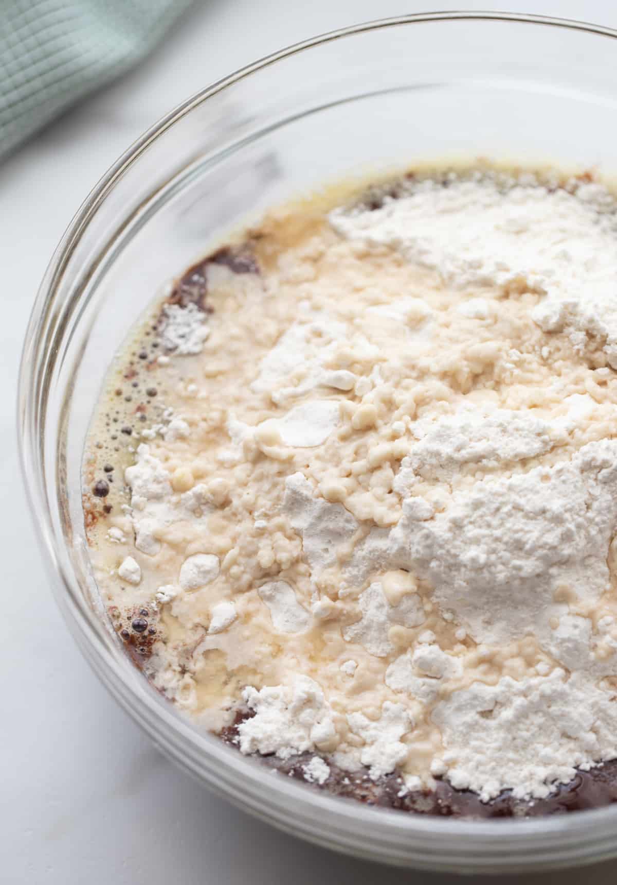 Dry ingredients mixed for bourbon chocolate brownies Flour, sugar, and salt combined in a clear mixing bowl, ready for brownie batter