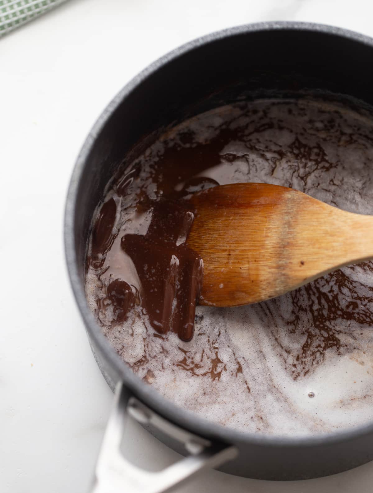 Melting butter and dark chocolate for brownie batter Butter and dark chocolate melting together in a saucepan for the brownie base