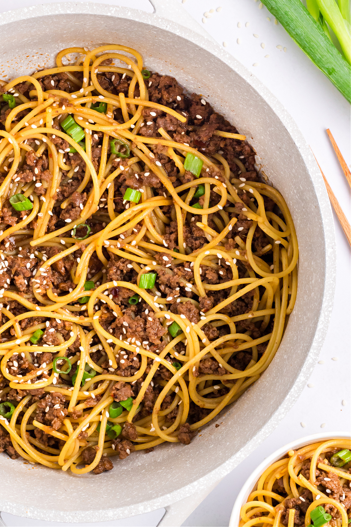 Takeout-style Mongolian noodles in soy garlic sauce Takeout-style noodles in soy garlic Mongolian sauce tossed with ground beef, sesame seeds, and green onions.