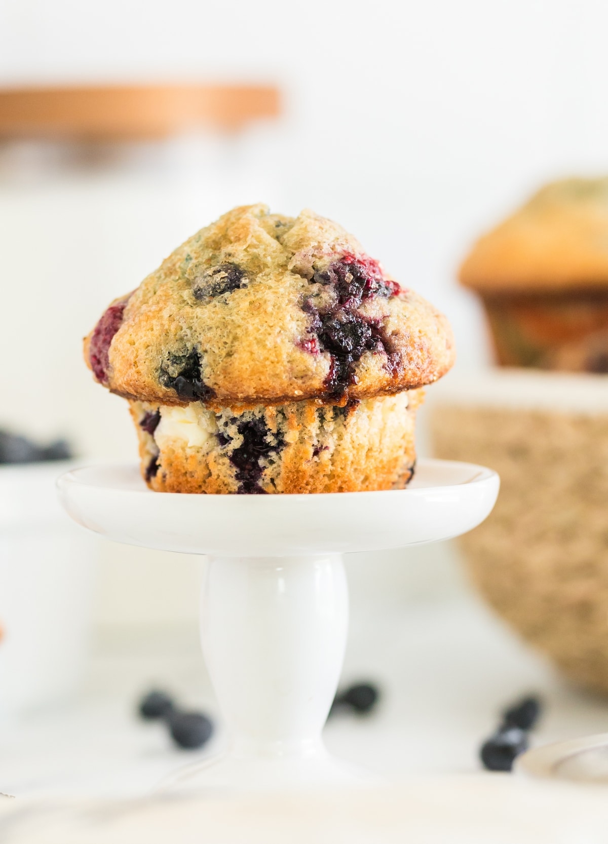 Tender berry muffins that aren't too sweet, with a light and airy texture and chunks of cream cheese baked into every bite. cream cheese muffins