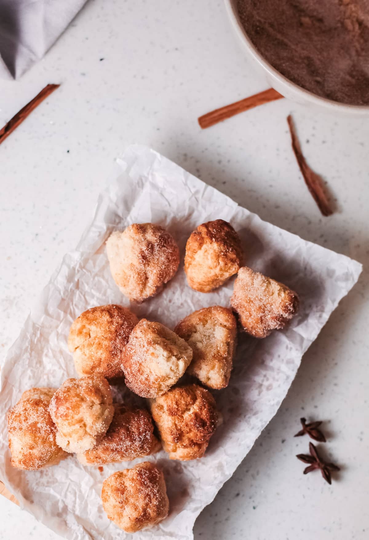 These air fryer cinnamon sugar donut holes are my quick and easy solution for satisfying donut cravings. This lightened-up version of classic cinnamon sugar donuts means I don't miss a thing when I pop a few of these in my mouth. They're just as good, if not better, than anything I'd get at a donut shop. cinnamon sugar donuts