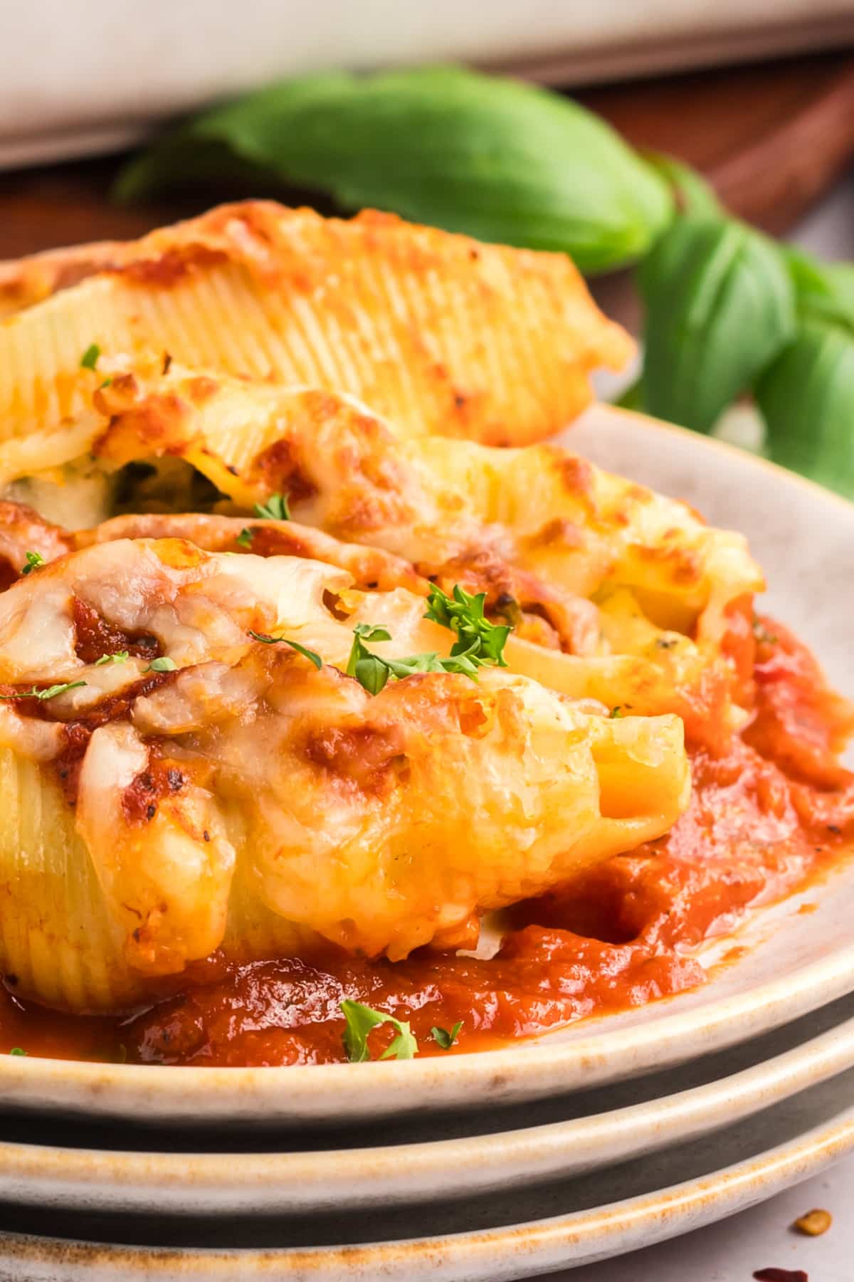 plated stuffed shells with ricotta and red sauce