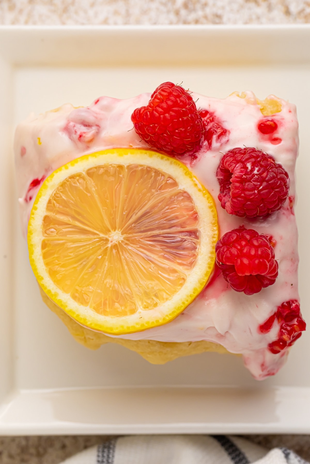 a slice of raspberry lemon cake