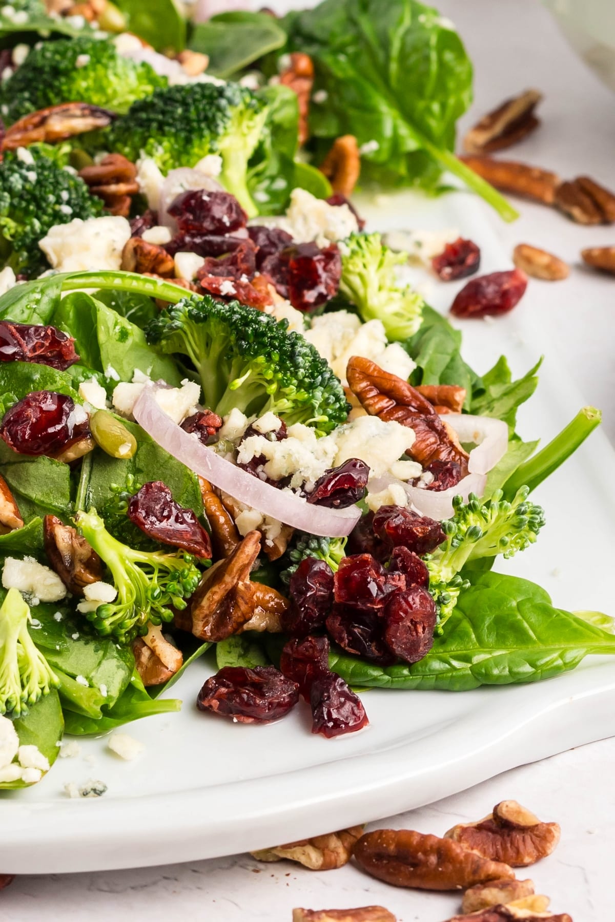Overhead view of a fresh spinach salad. Overhead view of a fresh spinach salad with Dijon Vinaigrette.