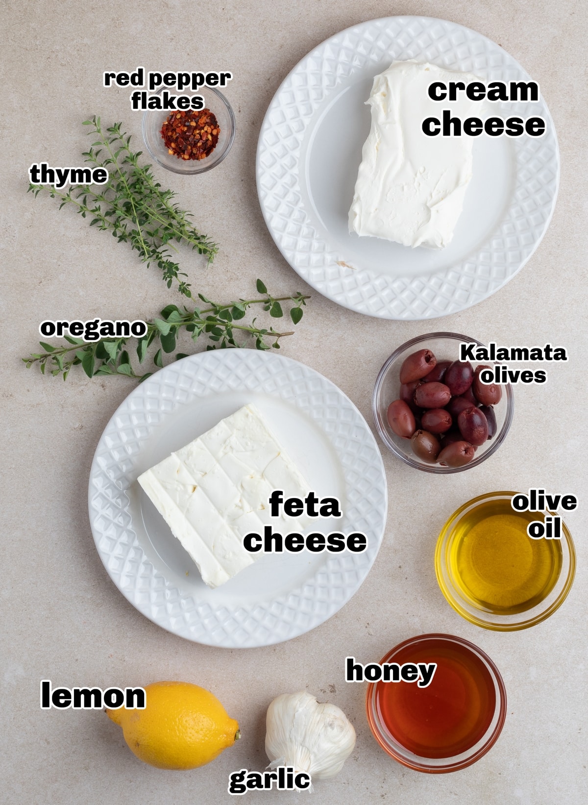 Whipped Feta Roasted Garlic Dip Ingredients. Ingredients for whipped feta roasted garlic dip with honey including feta, cream cheese, roasted garlic, lemon, and honey.