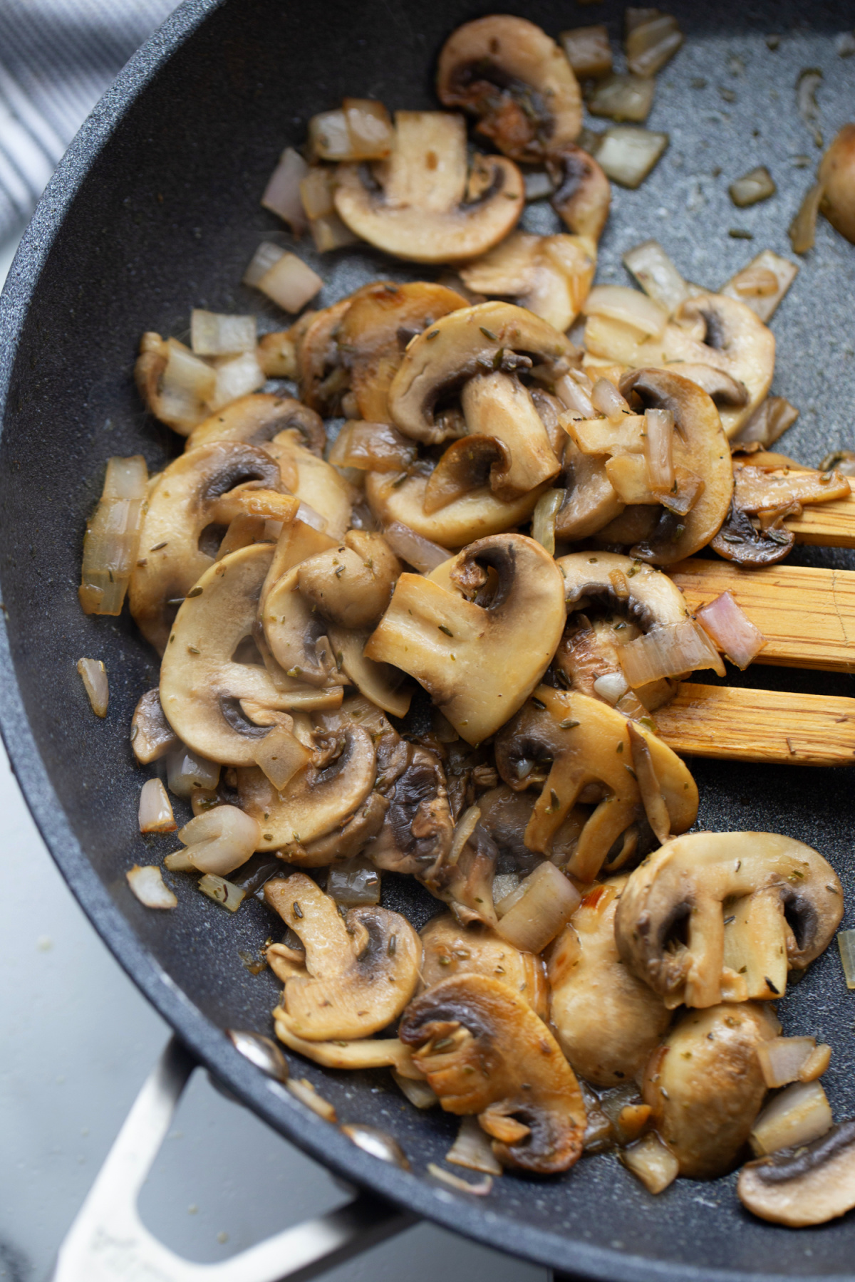 Browned mushrooms, shallots, and thyme cooking for the pork Marsala sauce.