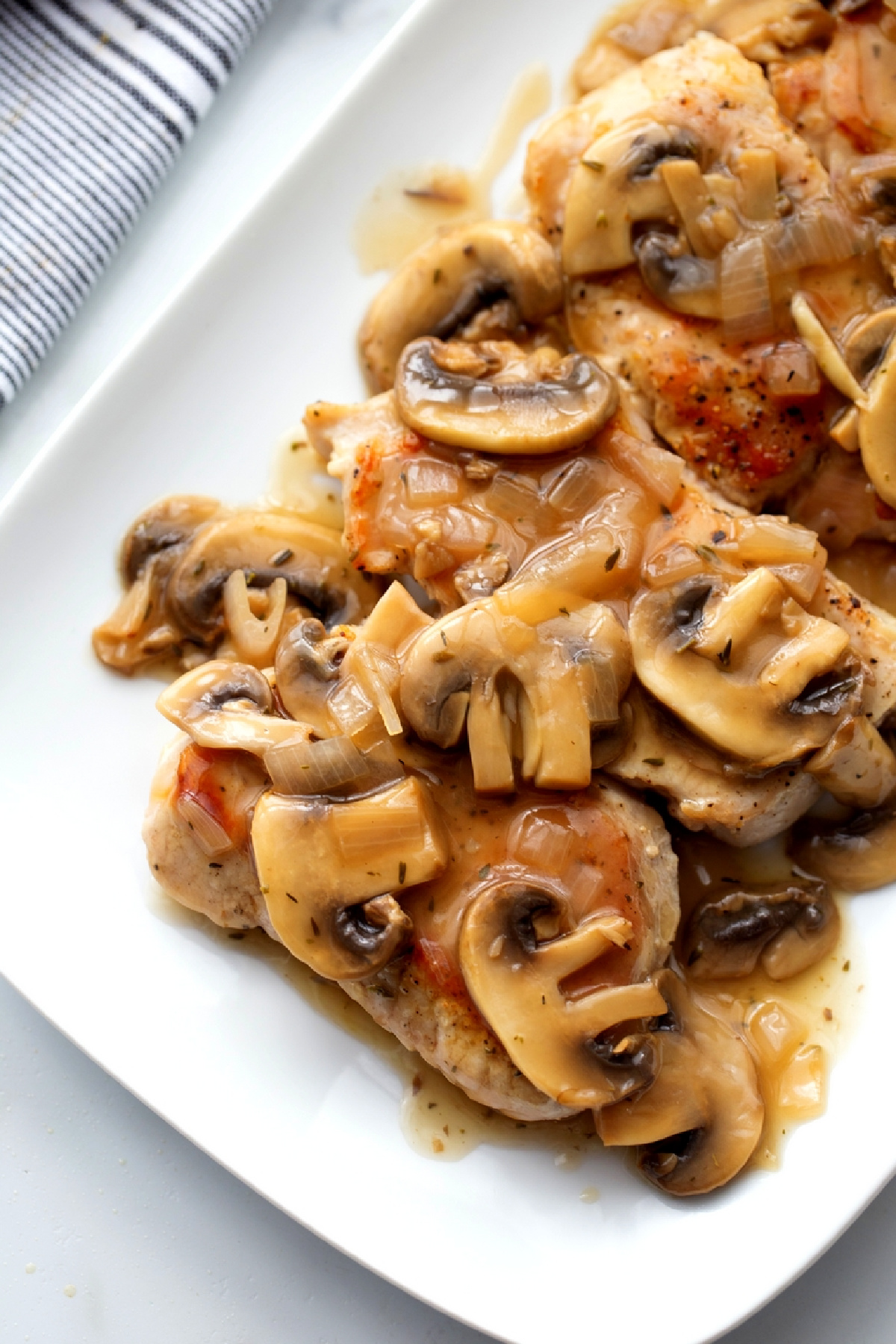 Pork Marsala with thin boneless pork chops topped with a mushroom Marsala sauce.