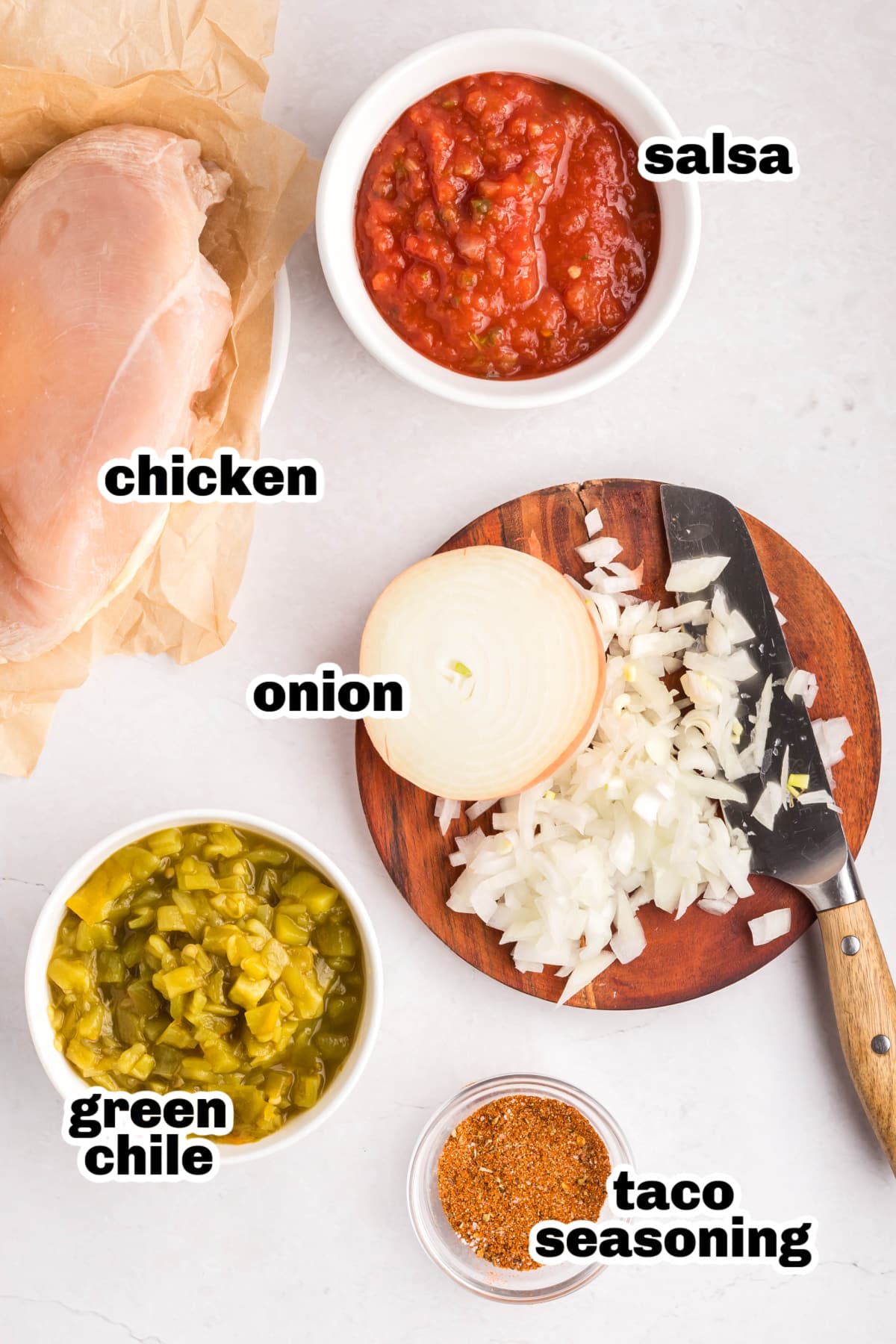 Slow Cooker Shredded Taco Chicken ingredients Overhead view of the five main ingredients laid out for slow cooker shredded taco chicken.