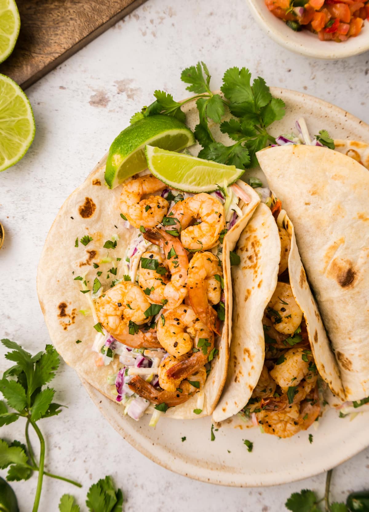 Top view of one open-faced taco showing the filling and one closed taco ready to serve