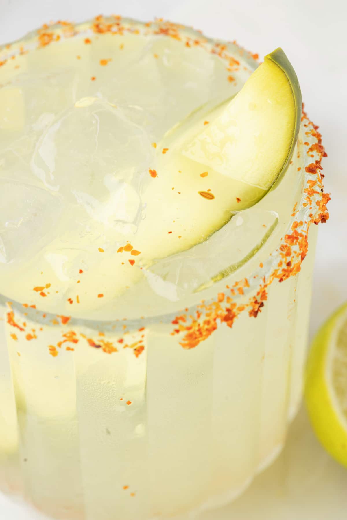 Overhead close-up of margarita with detailed Tajín rim 