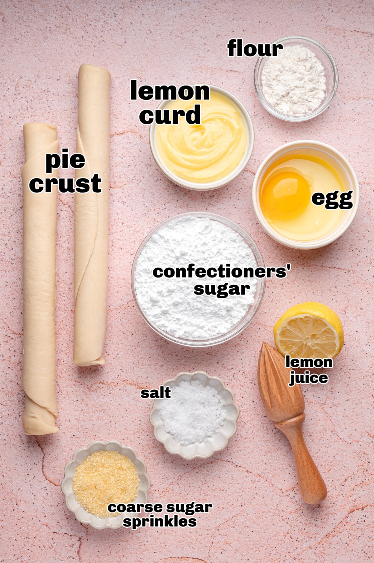 Lemon pop tart ingredients on pink background Overhead shot of ingredients for homemade lemon pop tarts, including pie crust, lemon curd, egg, and sugar
